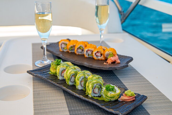 Sushi platter and wine on sunset cruise